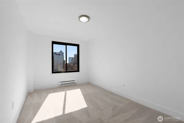 a view of an empty room with a window