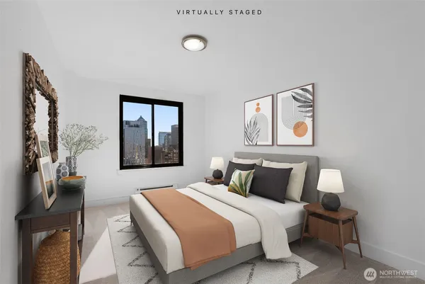 a bedroom with a bed and painting on the wall