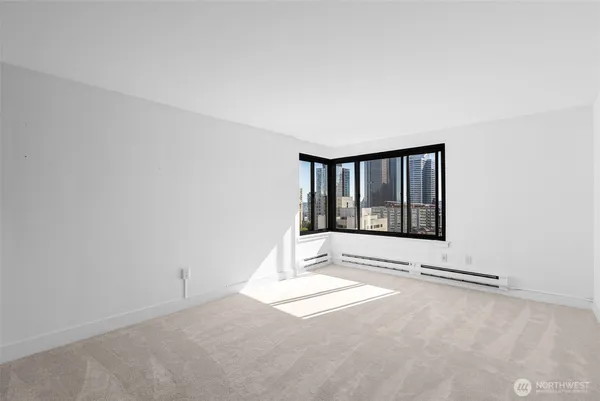 a view of an empty room with a window