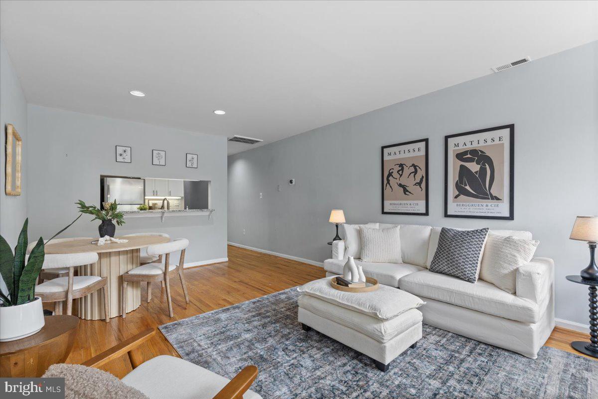 731 South Hanover Street, Unit R2 Baltimore, MD 21230 - Photo 2 of 17 a living room with furniture kitchen view and a table