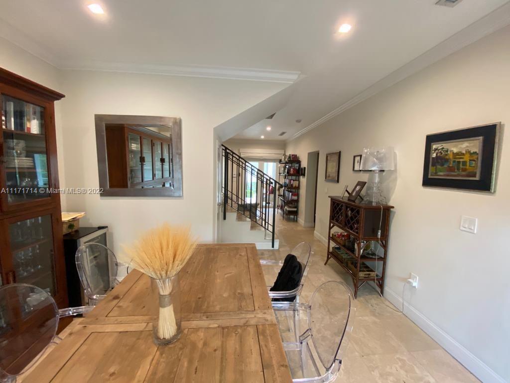 584 Fernwood Road Key Biscayne, FL 33149 - Photo 18 of 24 a view of a livingroom with furniture and a flat screen tv