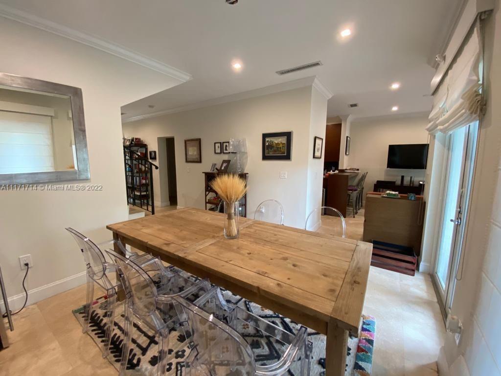 584 Fernwood Road Key Biscayne, FL 33149 - Photo 19 of 24 a view of a dining room with furniture
