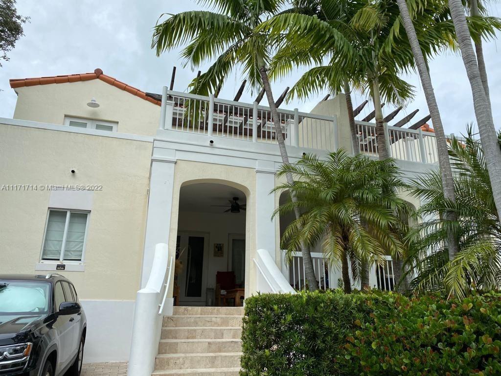 584 Fernwood Road Key Biscayne, FL 33149 - Photo 23 of 24 a view of a house with a palm tree