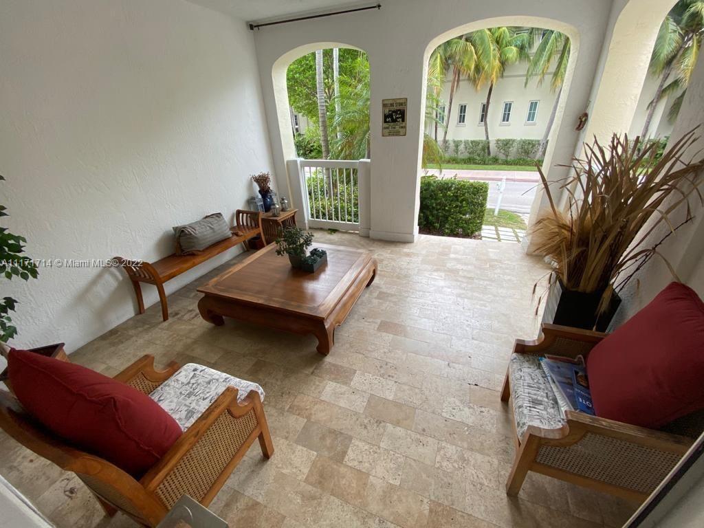 584 Fernwood Road Key Biscayne, FL 33149 - Photo 5 of 24 a living room with furniture and a large window
