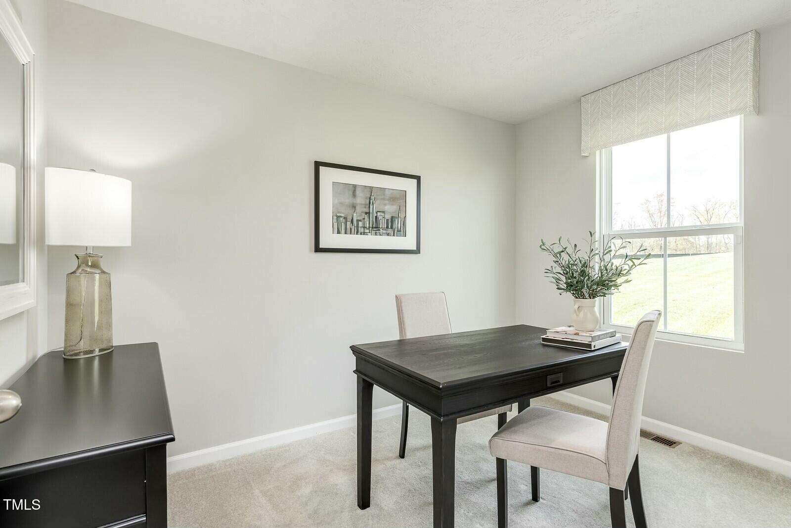4185 Mantis Court Bailey, NC 27807 - Photo 11 of 20 a view of a dining room with furniture and window