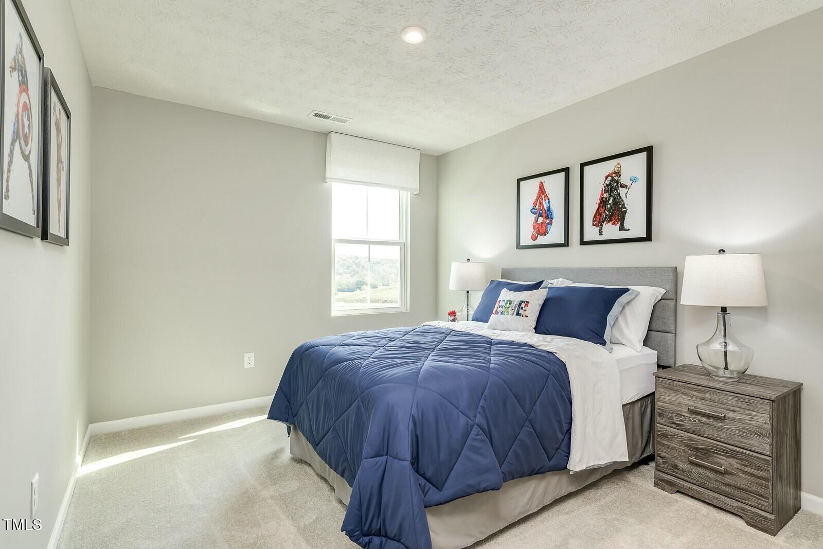 4185 Mantis Court Bailey, NC 27807 - Photo 16 of 20 a spacious bedroom with a bed and a window