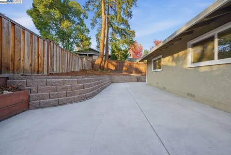 an aerial view of a house with a garden