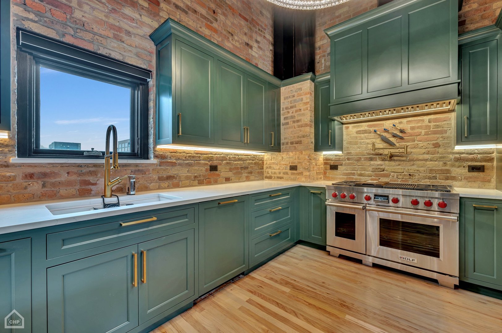 1017 West Washington Boulevard, Unit 7APH Chicago, IL 60607 - Photo 4 of 30 a kitchen with stainless steel appliances granite countertop a sink and a stove