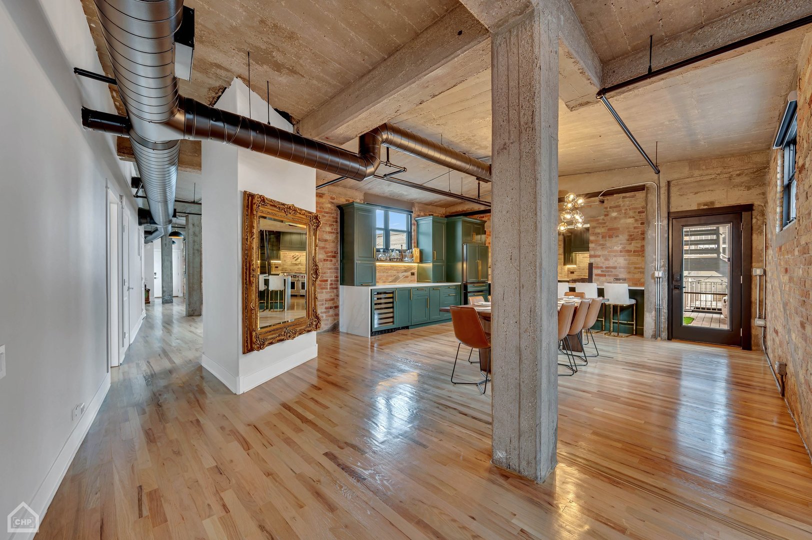 1017 West Washington Boulevard, Unit 7APH Chicago, IL 60607 - Photo 10 of 30 a view of a hallway with wooden floor and furniture