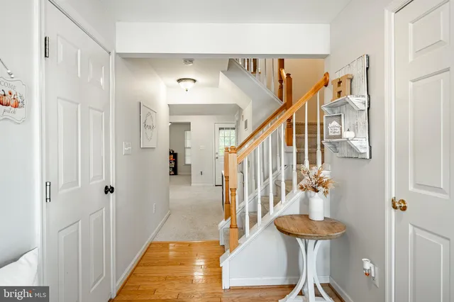a view of an entryway with wooden floor