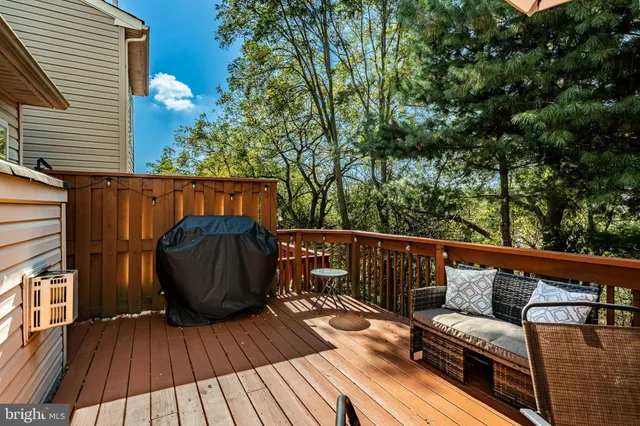 a view of chairs and table in the patio