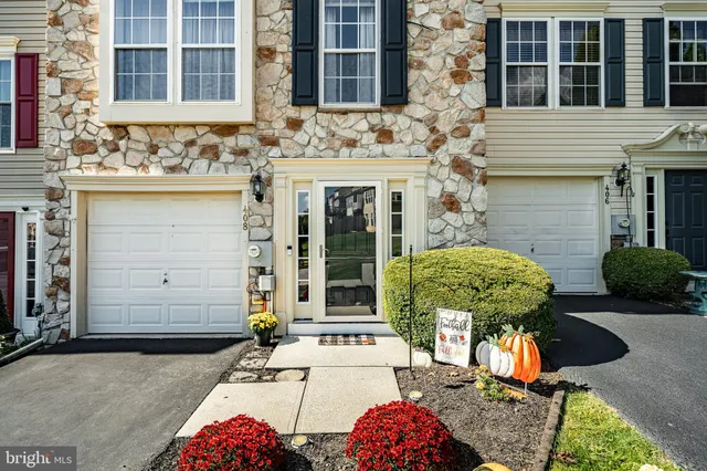 a view of a house with outdoor seating space
