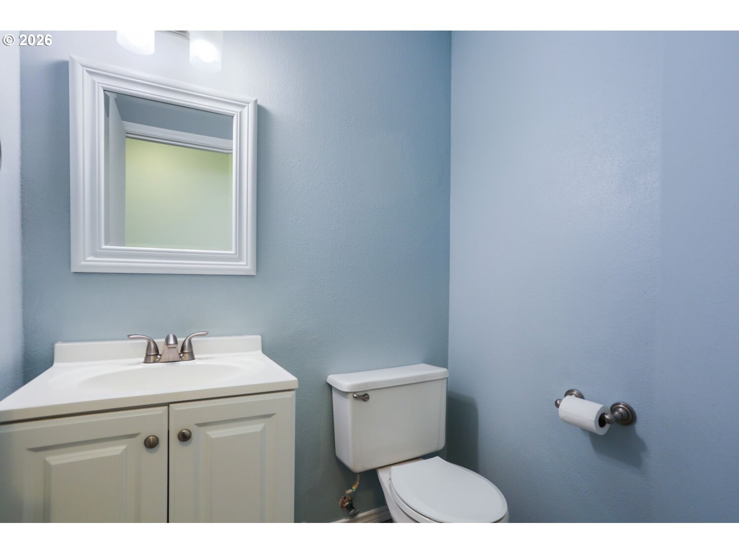 8160 Southwest 147th Terrace Beaverton, OR 97007 - Photo 16 of 31 a bathroom with a toilet sink and mirror