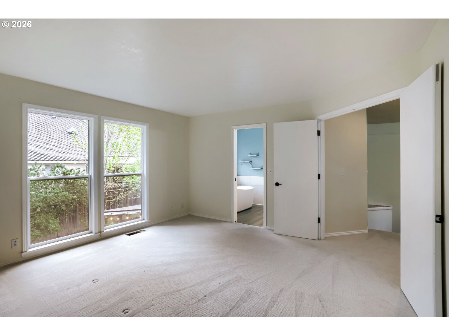 8160 Southwest 147th Terrace Beaverton, OR 97007 - Photo 17 of 31 a view of an empty room with a window