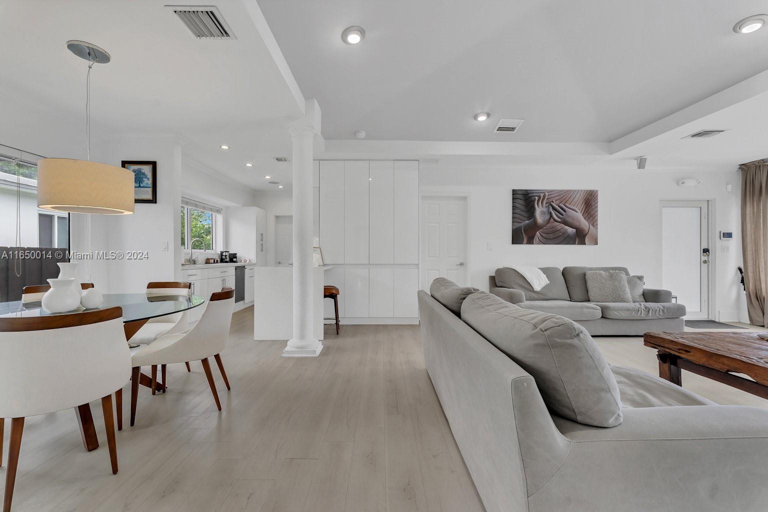 900 Surfside Boulevard Surfside, FL 33154 - Photo 11 of 38 a living room with furniture and a flat screen tv