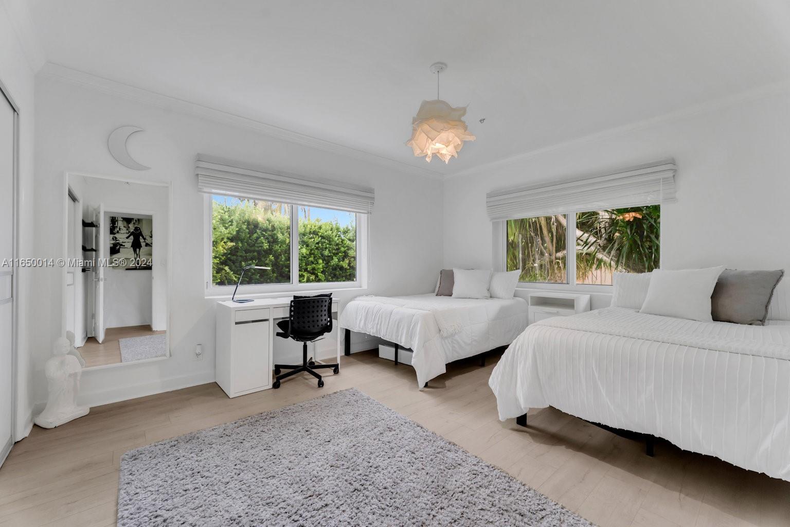 900 Surfside Boulevard Surfside, FL 33154 - Photo 20 of 38 a bed room with a bed and a large window