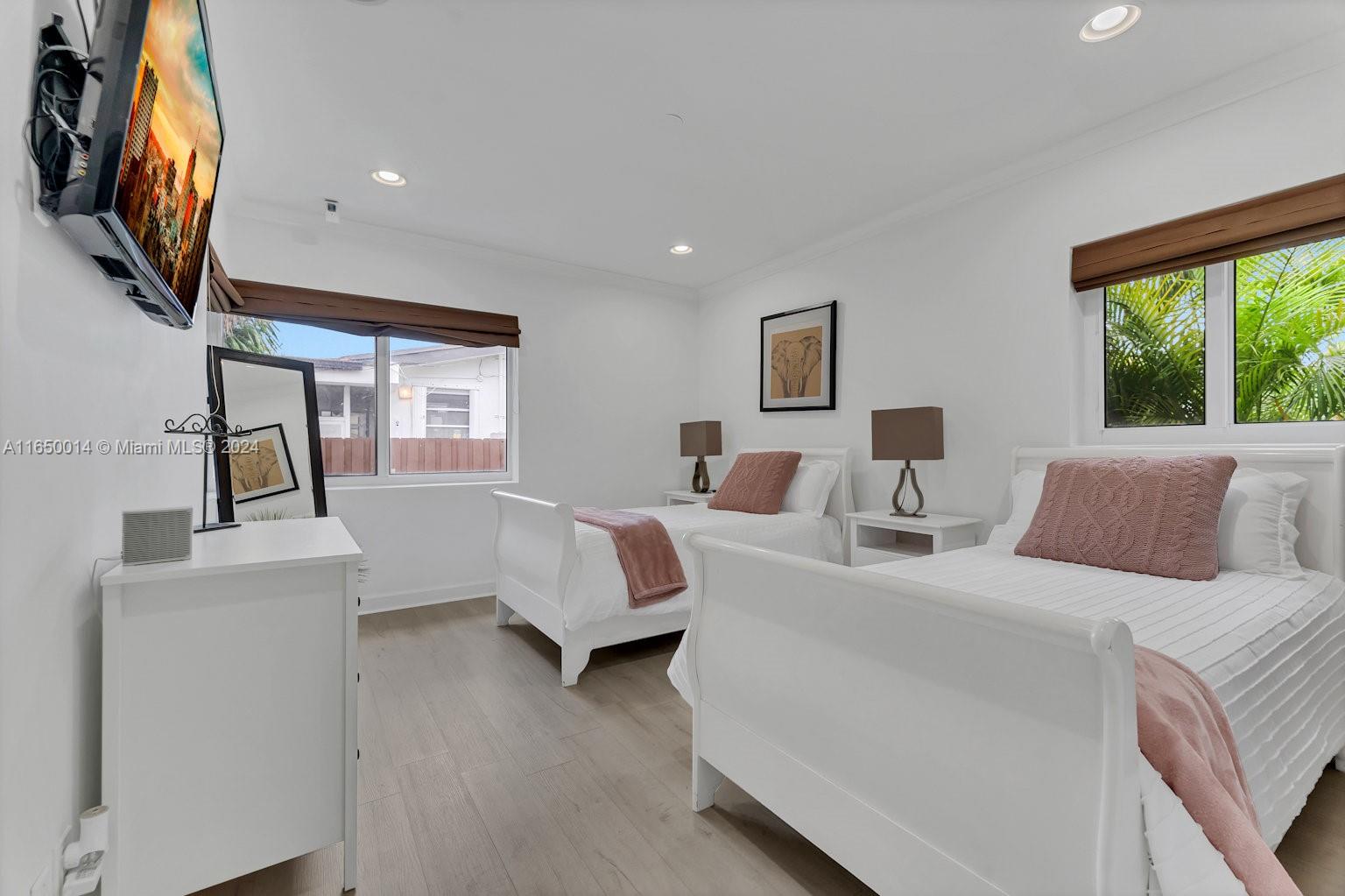 900 Surfside Boulevard Surfside, FL 33154 - Photo 23 of 38 a hotel room with large bed and a window