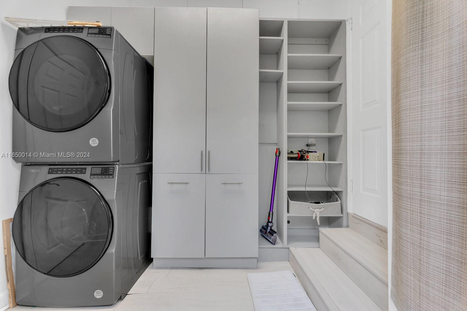 900 Surfside Boulevard Surfside, FL 33154 - Photo 30 of 38 a utility room with dryer and washer