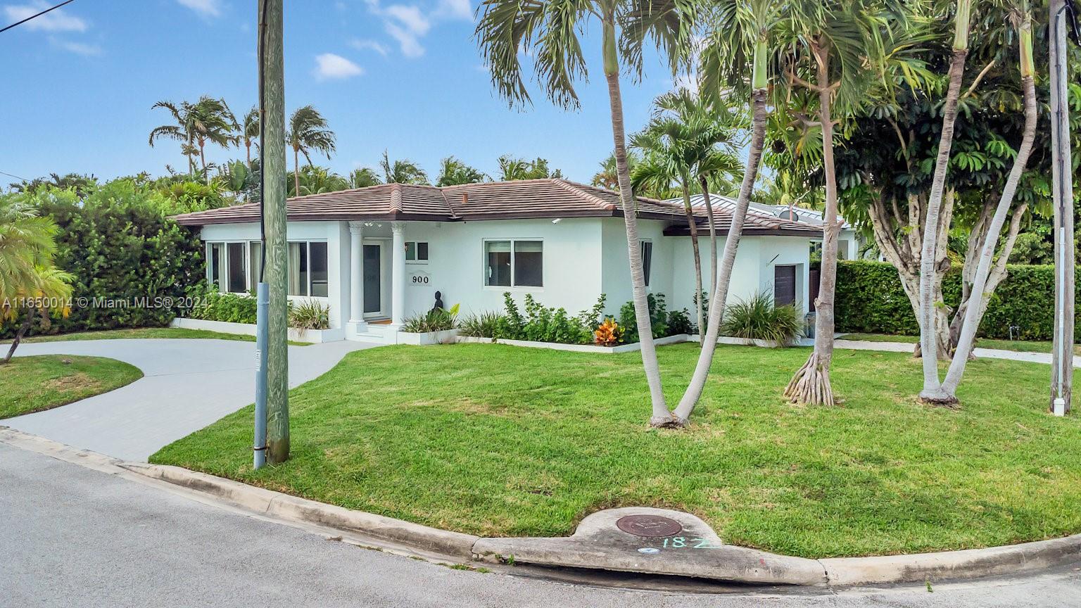 900 Surfside Boulevard Surfside, FL 33154 - Photo 31 of 38 a house with garden in front of it