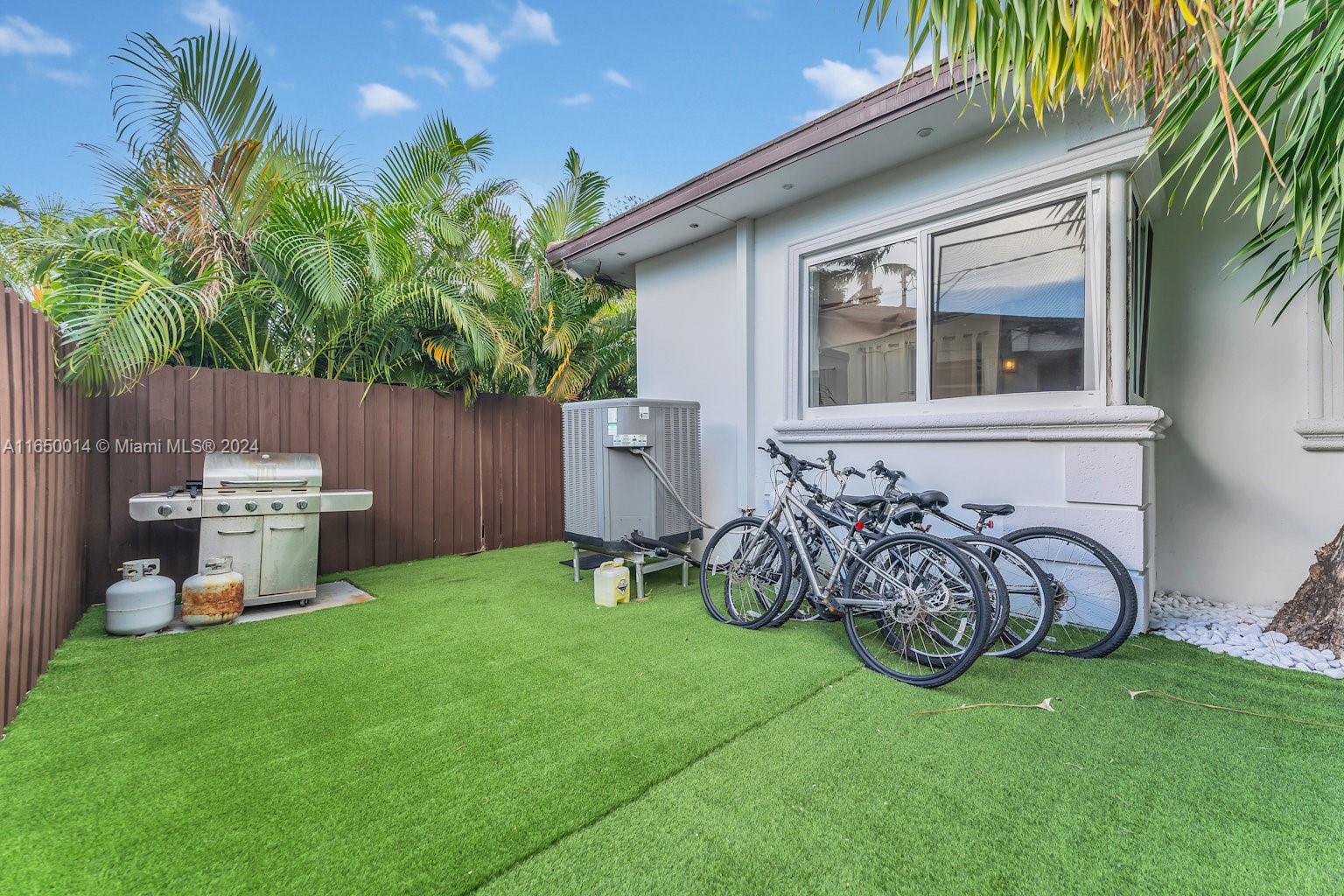 900 Surfside Boulevard Surfside, FL 33154 - Photo 37 of 38 a view of a chair and table in backyard of the house