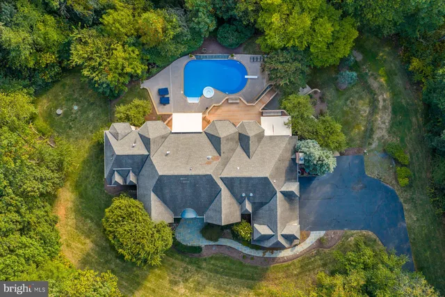 a front view of a house with a yard table and chairs