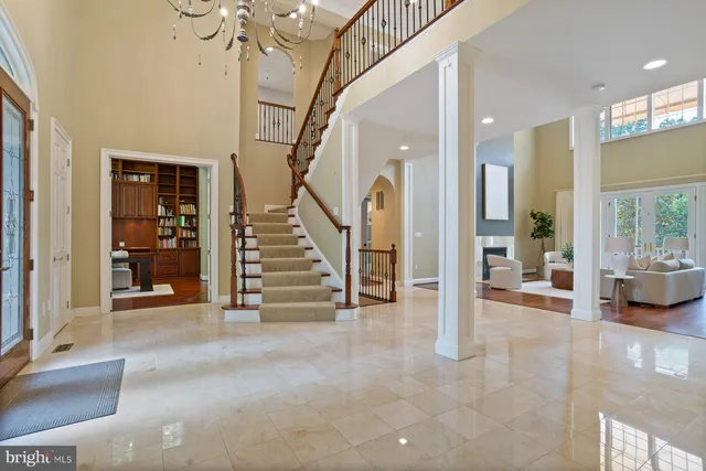 a view of an empty room with cabinet and a window
