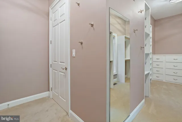 a kitchen with stainless steel appliances granite countertop a stove a sink dishwasher a microwave oven and a dining table with wooden cabinet