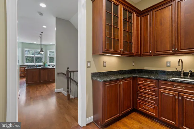 a view of an empty room with closet and a window