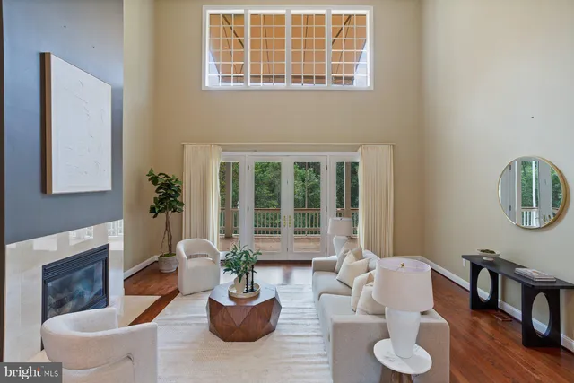 a bathroom with a tub sink double vanity and mirror