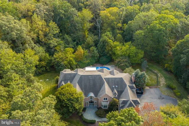 a view of house with outdoor space and swimming pool