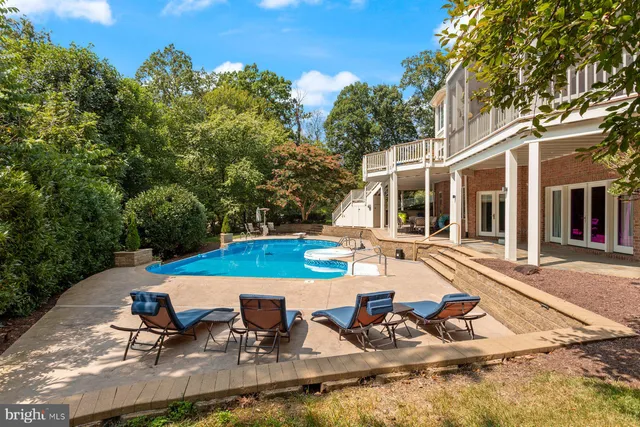 a view of a livingroom with furniture and stairs