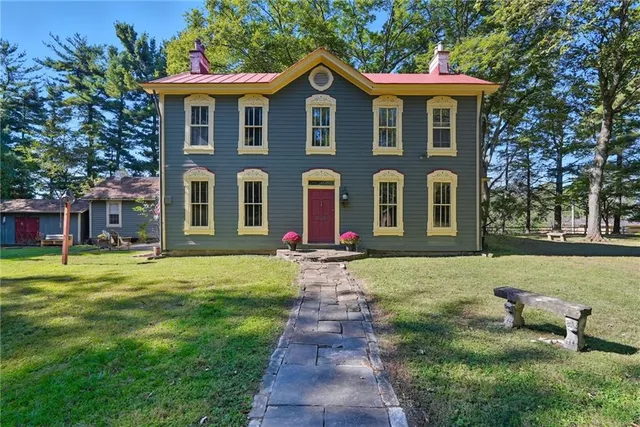 a front view of a house with garden