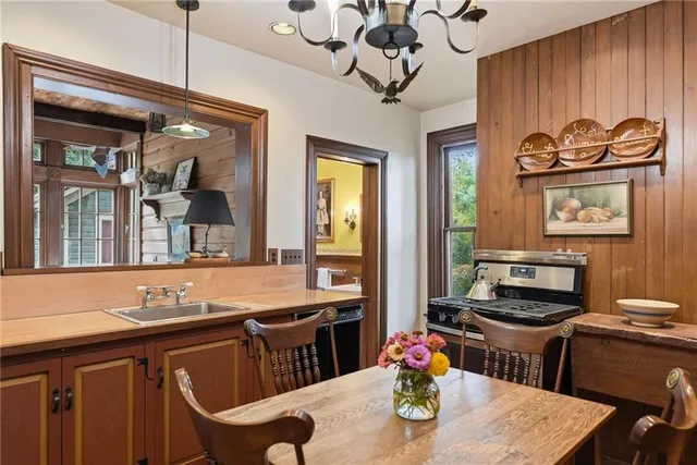 a kitchen with a table and chairs in it