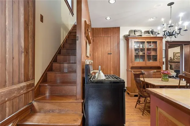 a view of a kitchen with granite countertop a refrigerator and a sink