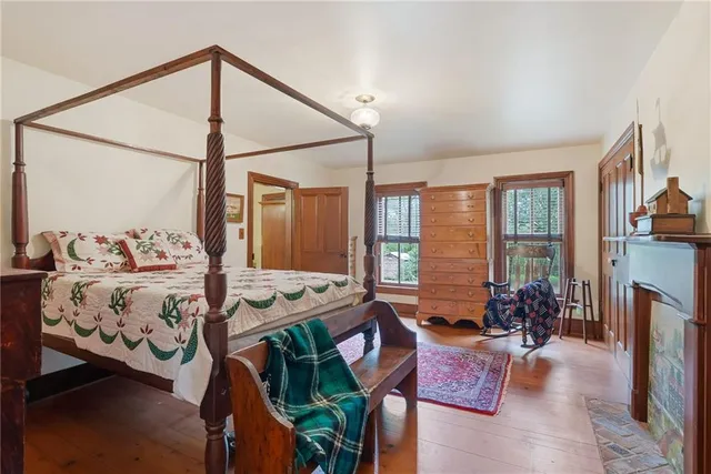 a bedroom with furniture and a window