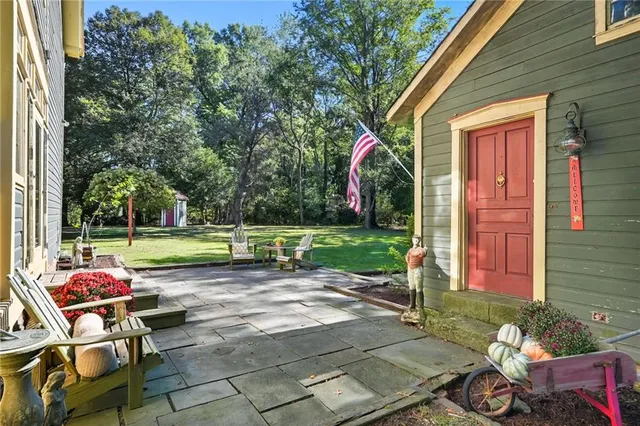 a view of a two chairs in the patio