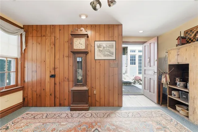 a view of a livingroom with furniture and staircase