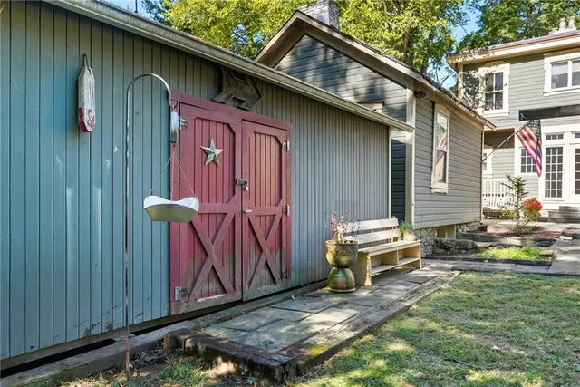 a backyard of a house with outdoor seating