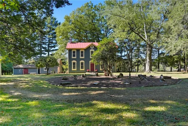 a view of a trees in front of a house