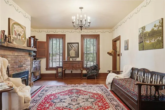 a living room with furniture windows and a fireplace