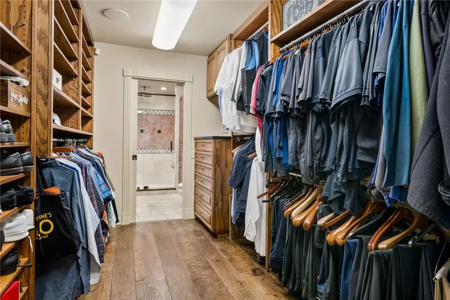 a bathroom with a shower sink and mirror