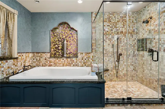 a utility room with cabinets dryer and washer