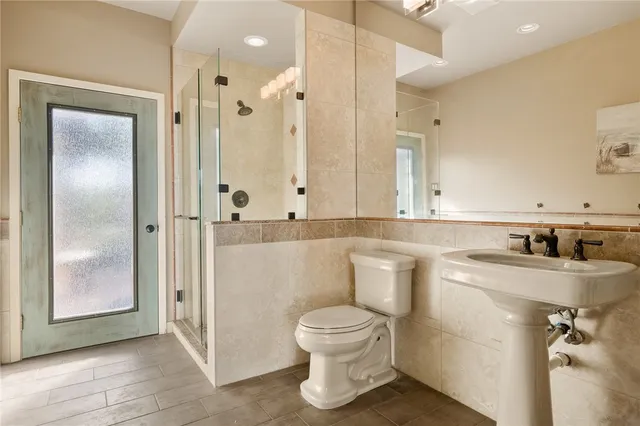 a kitchen with stainless steel appliances and cabinets