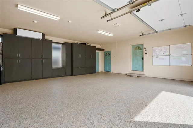 a view of a patio with couches table and chairs potted plants and large tree