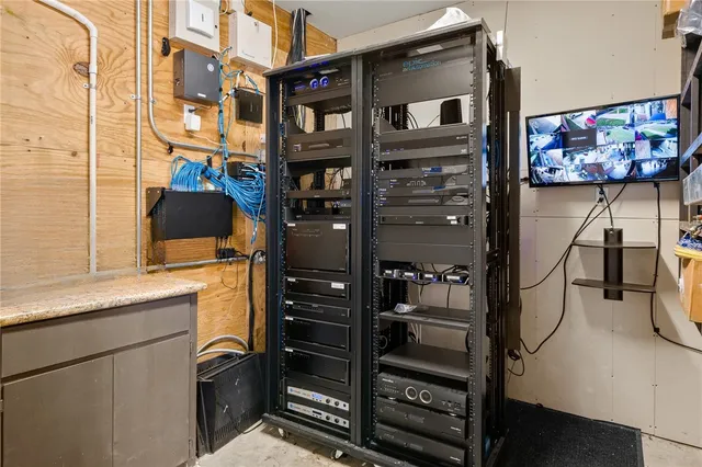 a building outdoor space with patio furniture and potted plants