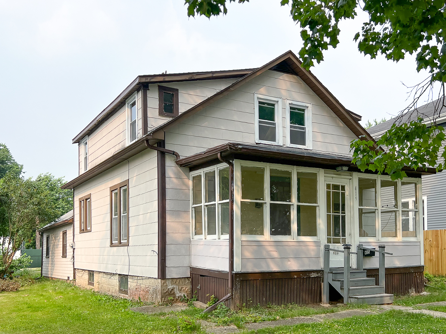 415 South 3rd Street Rochelle, IL 61068 - Photo 1 of 28 a front view of a house with a yard