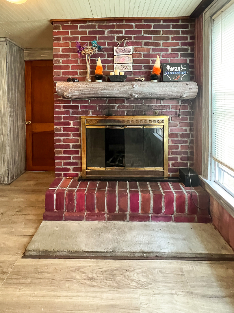 415 South 3rd Street Rochelle, IL 61068 - Photo 13 of 28 a view of fireplace with wooden floor