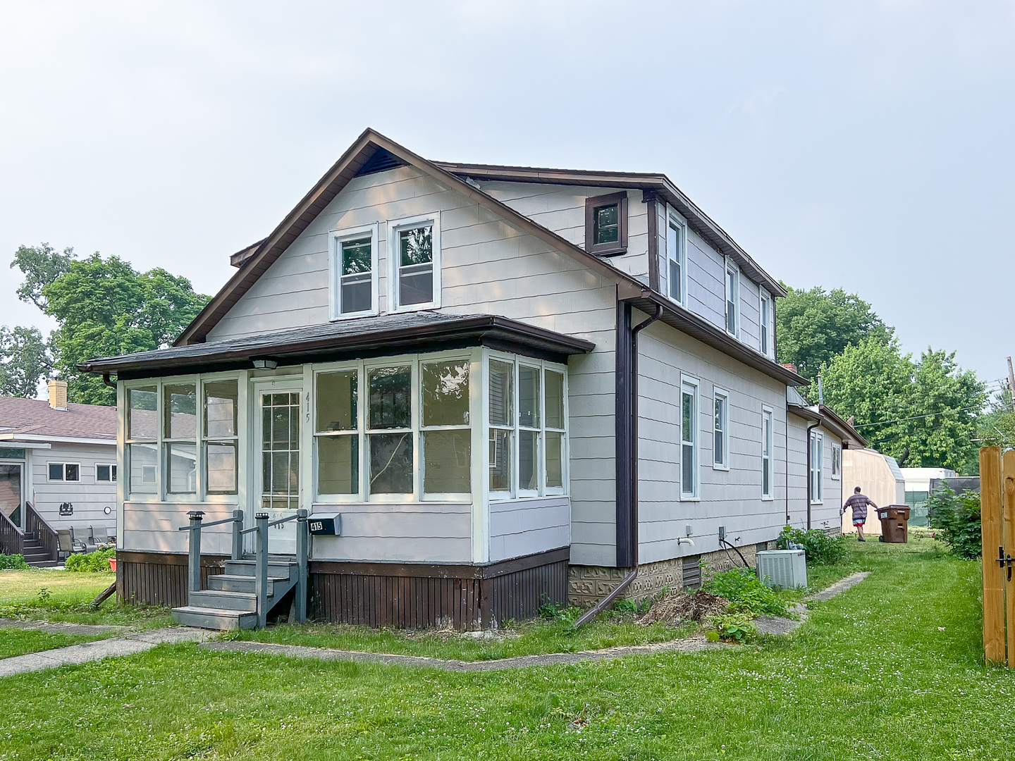 415 South 3rd Street Rochelle, IL 61068 - Photo 28 of 28 a front view of a house with a yard and porch