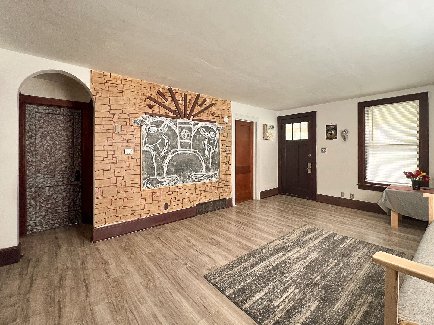 415 South 3rd Street Rochelle, IL 61068 - Photo 4 of 28 a view of an empty room with wooden floor and a window