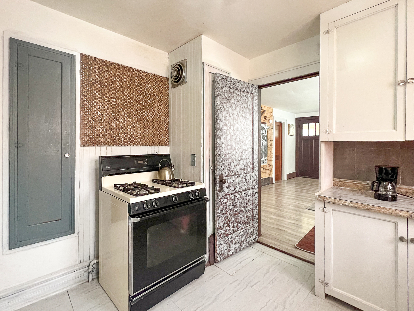 415 South 3rd Street Rochelle, IL 61068 - Photo 9 of 28 a kitchen with a stove and a refrigerator